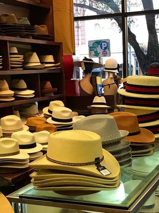 A display case filled with lots of hats.